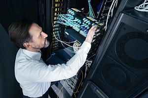 a managed IT service professional tending to a server rack