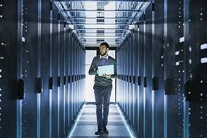 IT Technician Working in a data and IT systems.Remote data backup can be structured as either onsite or offsite