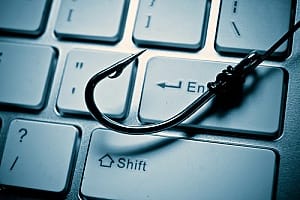 a hook on a keyboard representing phishing attacks or phishing scam