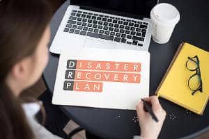 A woman working on disaster recovery plan