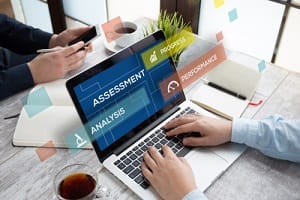 man using laptop and assessment concept